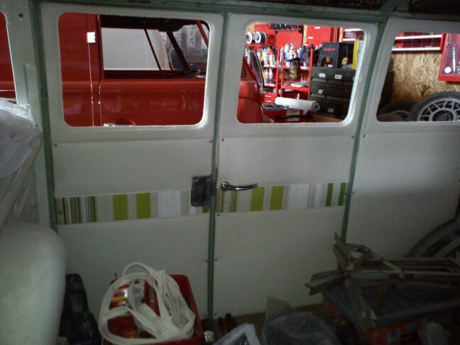 cargo door cards in and cream material glued to metal work all round